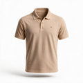 The Sahra Polo, front — embroidered logo on the chest, ribbed collar and placket
